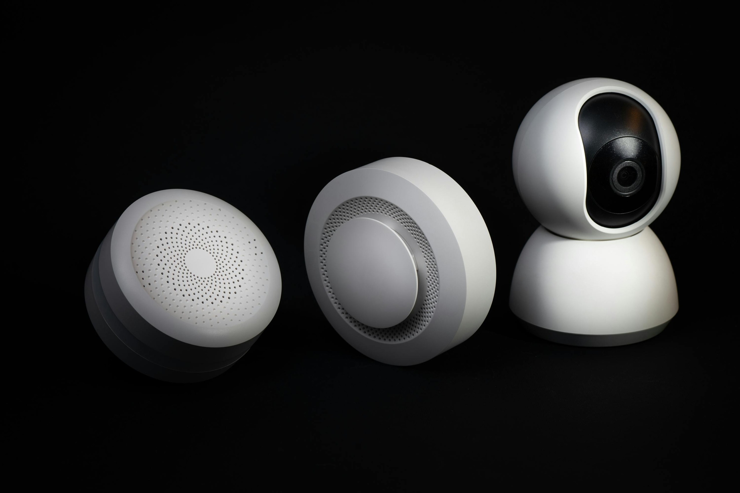 Elegant and innovative home automation devices on a sleek black background, showcasing modern technology.