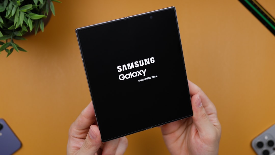Samsung Galaxy Z Fold 6 Turning On w/ " Samsung Galaxy Secured By Knox" on the Display | A person holding a black box with the samsung logo on it